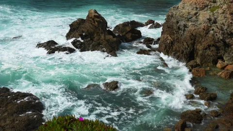 Ocean Waves Crash Against Rocky Shore Line Stock Footage 334593969