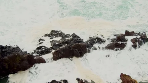 Ocean Waves Crash Against Volcanic Rocks in Iceland Stock Footage 320229277
