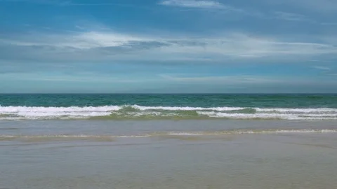 Ocean Waves Crash and Roll to Shallow Sandy Shore Stock Footage 76289690