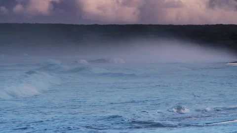 Ocean waves crash on black sand beach with misty sea spray and dark volcani.. Stock Footage 337804816