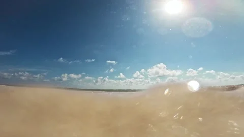 Ocean waves crash into the camera creating a transition wipe in Cancun, Mexico. Stock Footage 262349426