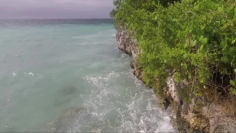 Ocean Waves crash on Rock Wall, Bantigue beach, Malapascua island, Philippines Stock Footage 246872291