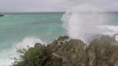 Ocean Waves crash on Rocks, Bantigue beach, Malapascua island, Philippines Stock Footage 282293241