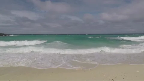 Ocean Waves crash on sandy Bantigue beach, Malapascua island, Philippines Stock Footage 246655544