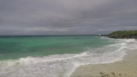 Ocean Waves crash on sandy Bantigue beach, Malapascua island, Philippines Stock Footage 246920692