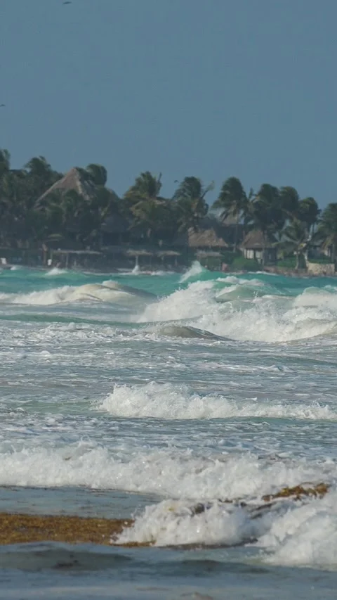 Ocean waves crash with white foam Stock Footage 345538835