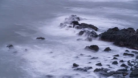 Ocean Waves Crashing Against Coastal Rocks with Misty Water Effect Time-lapse Stock Footage 326697953