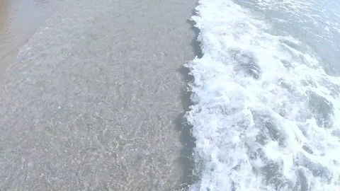 Ocean waves crashing against an empty beach Stock Footage 103162048