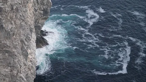 Ocean waves crashing against rocks Stock Footage 81002653