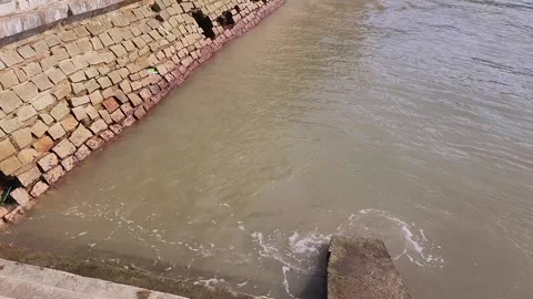 Ocean Waves Crashing Against Stone Seawall at High Tide Stock Footage 293230116