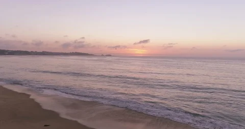 Ocean Waves Crashing On Beach at Sunset ‚ Aerial Drone View Stock Footage 103738482