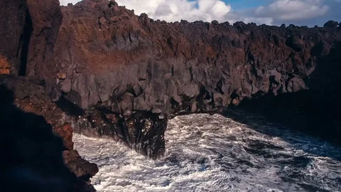 Ocean Waves crashing into cliffs and lava caves at Los Hervidores in Lanzarote Stock Footage 89155938