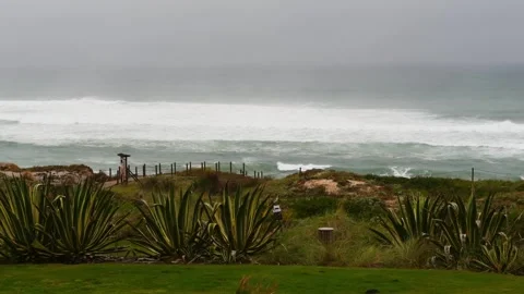 Ocean waves crashing on a cloudy gray day with copy space Video stock 307852343