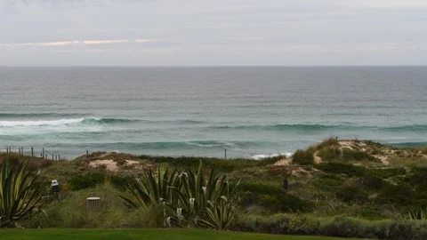 Ocean waves crashing on a cloudy gray day with copy space Stock Footage 307852361