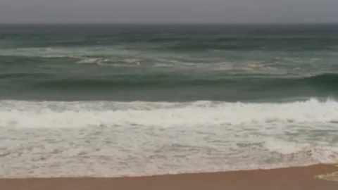 Ocean waves crashing on a cloudy gray day with copy space Stock Footage 307852372