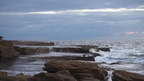 Ocean waves crashing down the rock shore Stock Footage 112974318