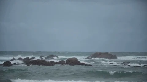 Ocean waves crashing down on rocks Stock Footage 128160482