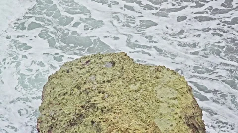 Ocean Waves Crashing with Foreground of Massive Coastal Rock Formation Stock Footage 296570590