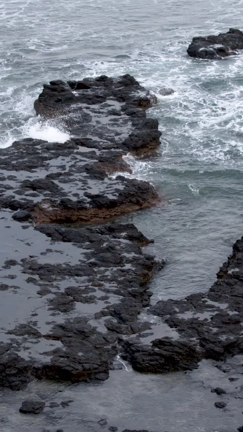 Ocean Waves Crashing Over Basalt Tide Pools on Mornington Peninsula Stock Footage 344616866