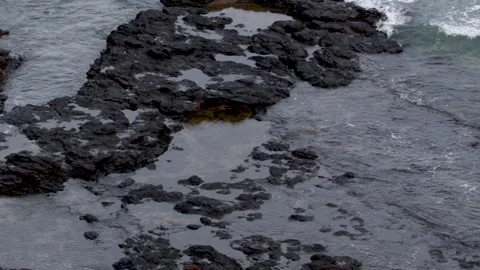 Ocean Waves Crashing Over Basalt Rock Tide Pools in Mornington Peninsula Stock Footage 345462383