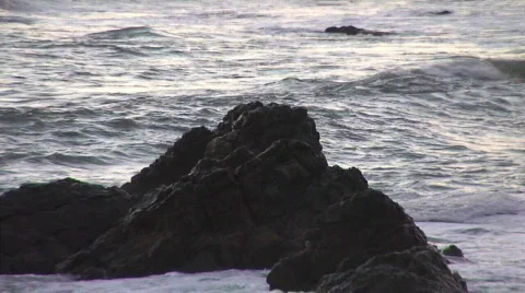 Ocean with waves crashing on rock Stock Footage 298980