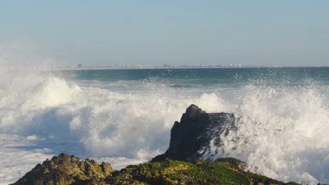 Ocean waves crashing on a rock, slow motion. Stock Footage 149948182