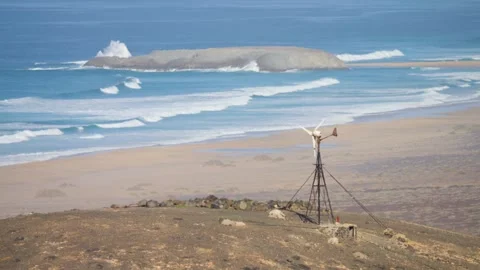 Ocean Waves Crashing on Rock with Windmill Heat Haze Fuerteventura 스톡 동영상 331311296