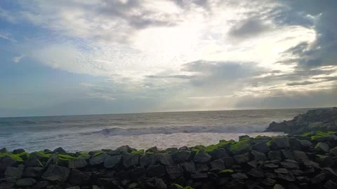 Ocean Waves Crashing on Rocks and evening rays Stock Footage 313148190