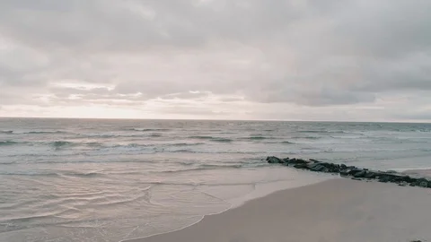 Ocean Waves Crashing on Rocks on Beach Aerial Drone at Sunrise Stock Footage 94426248