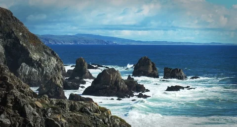 Ocean waves crashing on rocks with clouds in Northern California Stock Footage 87155246