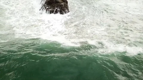 Ocean waves crashing into rocks Stock Footage 90456736