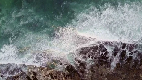Ocean waves crashing on rocks from overhead Stock Footage 71609806