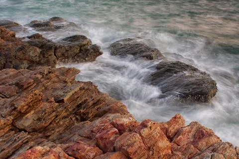 Ocean waves crashing onto the rocks Stock Photos
