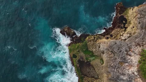 Ocean Waves Crashing on Rocky Coast Background – Aerial Top View 4K Stock Footage 329630089