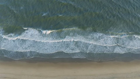 Ocean Waves Crashing on Sandy Beach Shoreline Aerial View with Movement Stock Footage 109391440