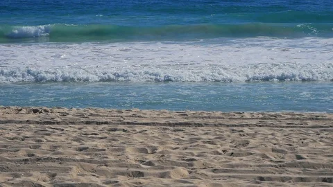 Ocean waves crashing sandy beach afternoon Stock Footage 115774438
