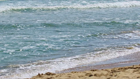 Ocean Waves Crashing on Sandy Beach Shore in Summer Stock Footage 308608938