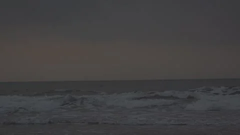 Ocean Waves Crashing on Sandy Beach - Moody Overcast Sea Stock Footage 336797753