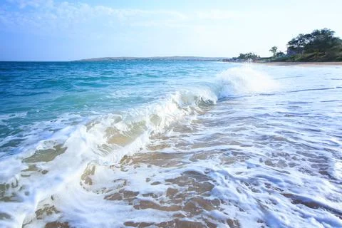 Ocean waves crashing on sandy beach. Sea waves breaking on shore. Nature splash Stock Photos