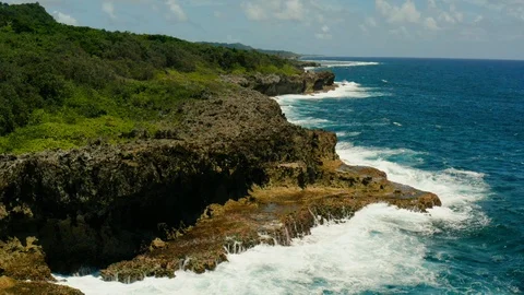 Ocean with waves crashing on the shore Stock Footage 128551834