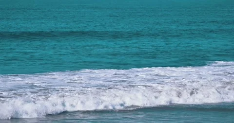 Ocean waves crashing on shore with turquoise water Stock Footage 339519933