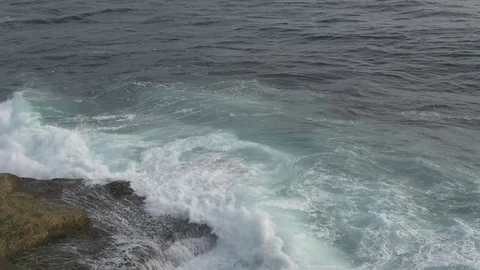 Ocean Waves Crashingon Small Rock Outcropping Aerial View Stock Footage 72436730