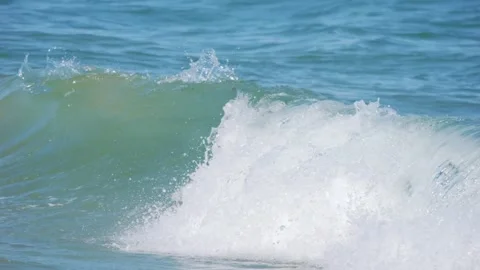 Ocean waves cresting and breaking on the shore in 4k slow motion 120fps Stock Footage 267566220