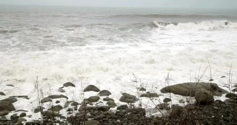 Ocean Waves During a Storm stormy weather sea wave hitting beach coral 動画素材 334647460