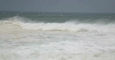 Ocean Waves During a Storm stormy weather sea wave hitting beach coral 動画素材 334647585
