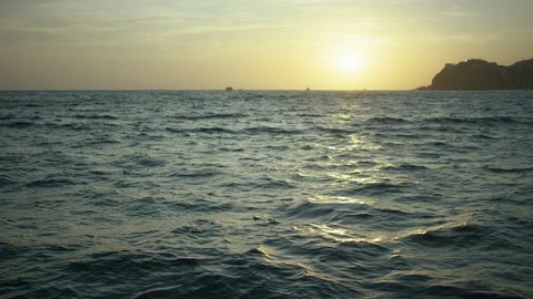 Ocean waves during sunset Stock Footage 106332928