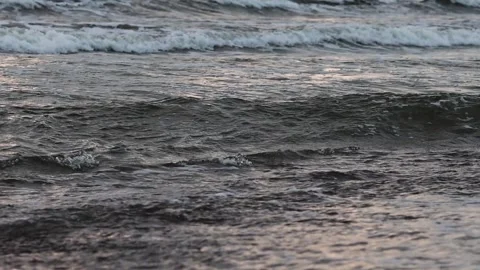 Ocean Waves at Dusk. Waves rolling in the ocean at dusk with a calming Stock Footage 284108521