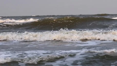 Ocean Waves at Dusk. Waves rolling in the ocean at dusk with a calming Stock Footage 284108547