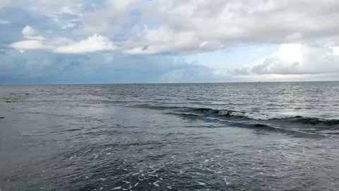 Ocean waves with endless horizon and cloudy sky Stock Footage 254644117