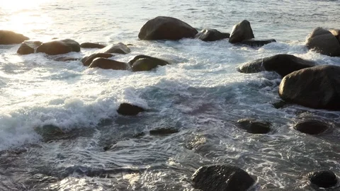 The ocean waves in the evening at the beach with many rocks Stock-Footage 107126646